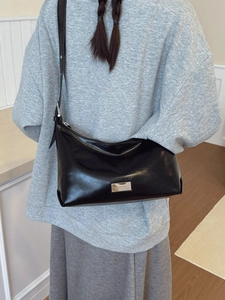 Minimalist black glossy leather hobo shoulder bag with adjustable strap for women