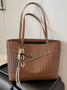 Brown woven checkered tote bag with chocolate charm and adjustable straps for women