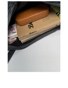 Spacious interior of dark grey checkered tote bag showing books and glasses case