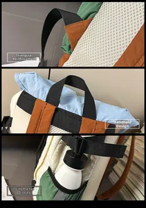 Close-up of reinforced shoulder straps, handle, and side pocket on a casual backpack