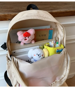 Internal view of beige outdoor backpack with multi-functional compartments for tablets and books