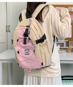 Detail of nylon backpack with adjustable buckles and elastic cords on desk background
