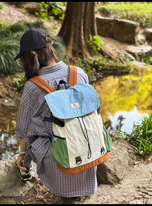 Outdoor leisure color-block backpack with drawstring closure and water-resistant fabric