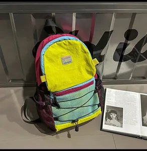 Detail view of the colorful hiking backpack with durable nylon fabric and mesh side pocket