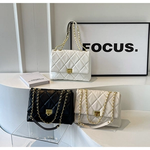 Three quilted faux leather shoulder bags with gold chain straps and square metal locks