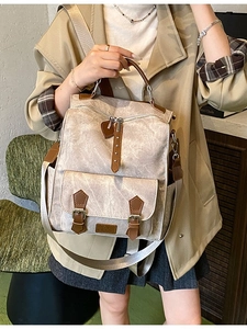 Beige vintage backpack for women with brown leather trim and adjustable nylon straps