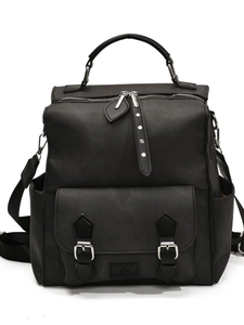 Classic black versatile backpack with double metal buckles and top handle for travel