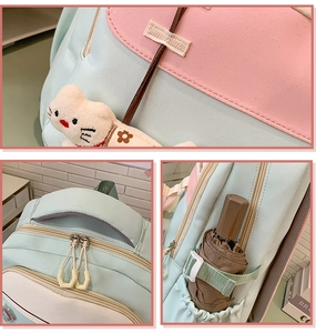 Close-up of backpack straps, dual zippers, and side pocket for umbrella or water bottle