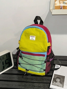 Colorful patchwork hiking backpack with multi-compartment design for outdoor travel