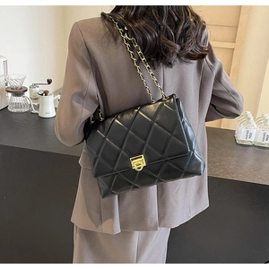 Classic black quilted leather crossbody bag with chain strap and gold twist-lock