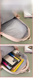 Pink backpack interior with large capacity compartment for laptop, A4 files and iPad