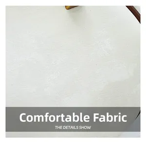 Detailed close-up of soft white knitted fabric showing delicate breathable texture