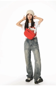 Red crossbody chest bag for sports, shown on model with multiple compartments