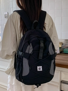 Lightweight black and gray patchwork backpack with bungee cord for students and commuting