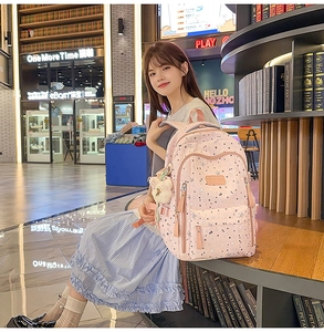 Pink nylon school backpack with star prints and doll pendant for students and laptops