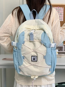 Lightweight cream and blue aesthetic school backpack with penguin patch and drawstrings