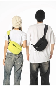 Close-up of adjustable strap and buckles on neon yellow and black crossbody bags