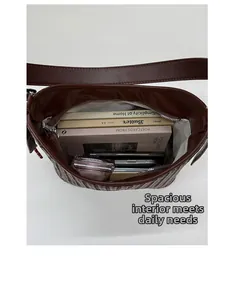 Top view of deep brown woven bucket bag interior showing large capacity and inner pockets
