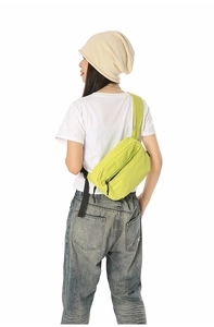 Detailed back view of neon yellow lightweight crossbody bag with multi-compartments