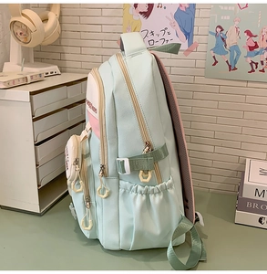 Detail of school backpack with Capybara text, side pockets and adjustable buckles
