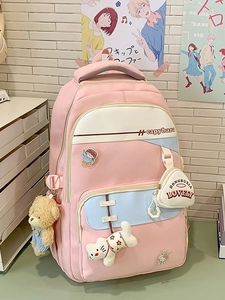 Pink and blue patchwork school backpack with cartoon badges and cute plush charms