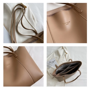 Détails du sac fourre-tout kaki montrant les compartiments et les coutures