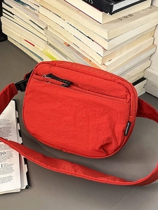 Bright red nylon crossbody chest bag with multiple pockets for outdoor casual sports use