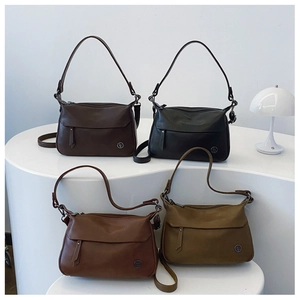 Detailed display of vintage faux leather shoulder bags in four classic autumn colors