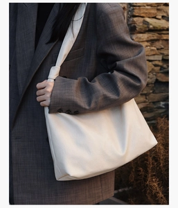 Retro white large tote bag with lychee texture styled on model in grey plaid blazer