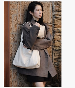 Minimalist large white tote bag and matching zippered pouch set with knot strap detail