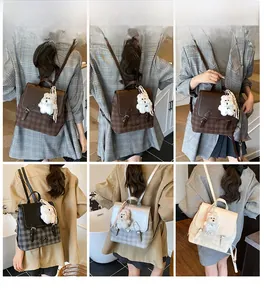 Detail view of retro plaid backpacks with plush dog charms in multiple stylish colors