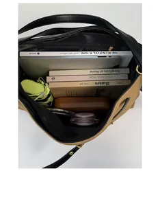 Top view of large capacity vintage tote bag showing spacious interior with books and laptop