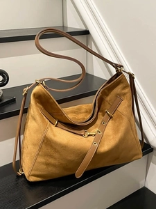 Caramel brown large faux suede tote bag with vintage metal grommets and shoulder strap