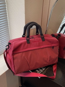 Red large capacity nylon fitness travel bag with black handles and adjustable shoulder strap