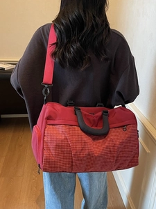 Red plaid large capacity gym bag with adjustable shoulder strap and sturdy handles