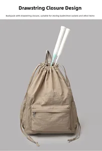 Detail view of khaki drawstring backpack showing large capacity for badminton rackets