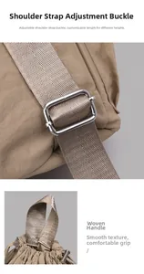 Detail of adjustable nylon straps with metal buckles and a woven top handle for a backpack