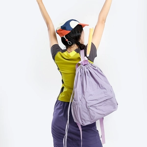 Lightweight lavender nylon drawstring backpack with tennis racket storage compartment
