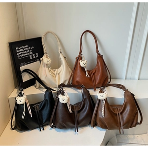 Detailed display of five color options for the vintage hobo bag with bear charms