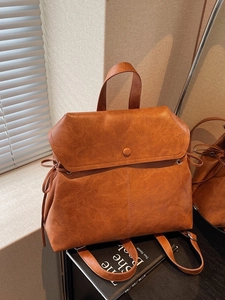 British vintage caramel brown leather backpack with round buckle and large capacity