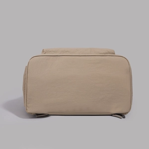 Detail of the durable bottom and back structure of this khaki large capacity backpack