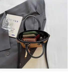 Top view of mini monogram bucket bag showing interior space for phone and wallet