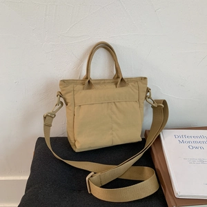 Khaki nylon small tote bag with detachable crossbody strap and reinforced stitching