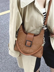 Brown faux snakeskin crossbody bag with gold chain and metal buckle for women