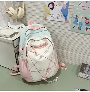 Pastel school backpack detail with elastic star mesh on a minimalist study desk