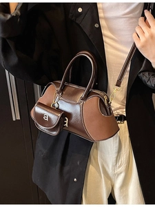 Retro matte leather Boston bag in dark brown with contrast stitching and shoulder strap