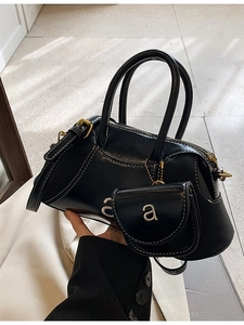 Retro black glossy leather handbag with small pouch and adjustable shoulder strap