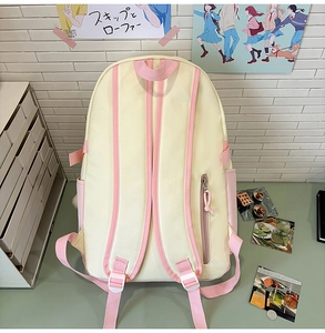 Detail view of the backpack back showing wide pink straps and hidden zipper pocket