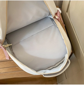 Interior view of spacious minimalist backpack with main compartment and grey lining