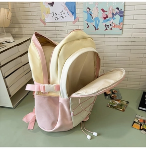 Detail showing the spacious interior storage and multi-pocket design of this school backpack